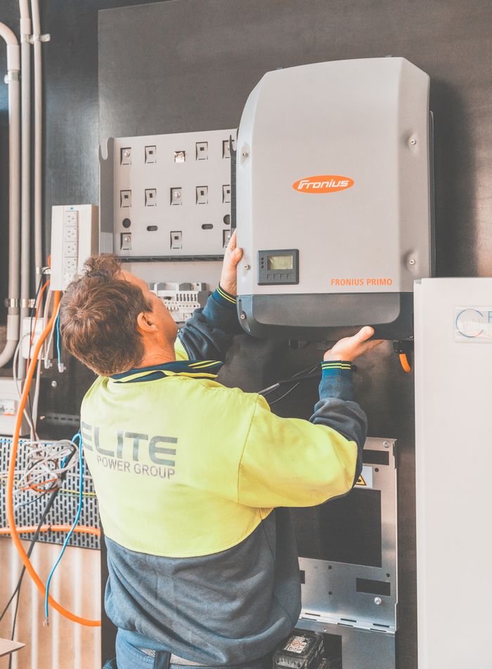 Crafting Captivating Headlines: Your awesome post title goes here Expert technician setting up a solar inverter in Thornton, NSW, ensuring efficient solar energy flow.