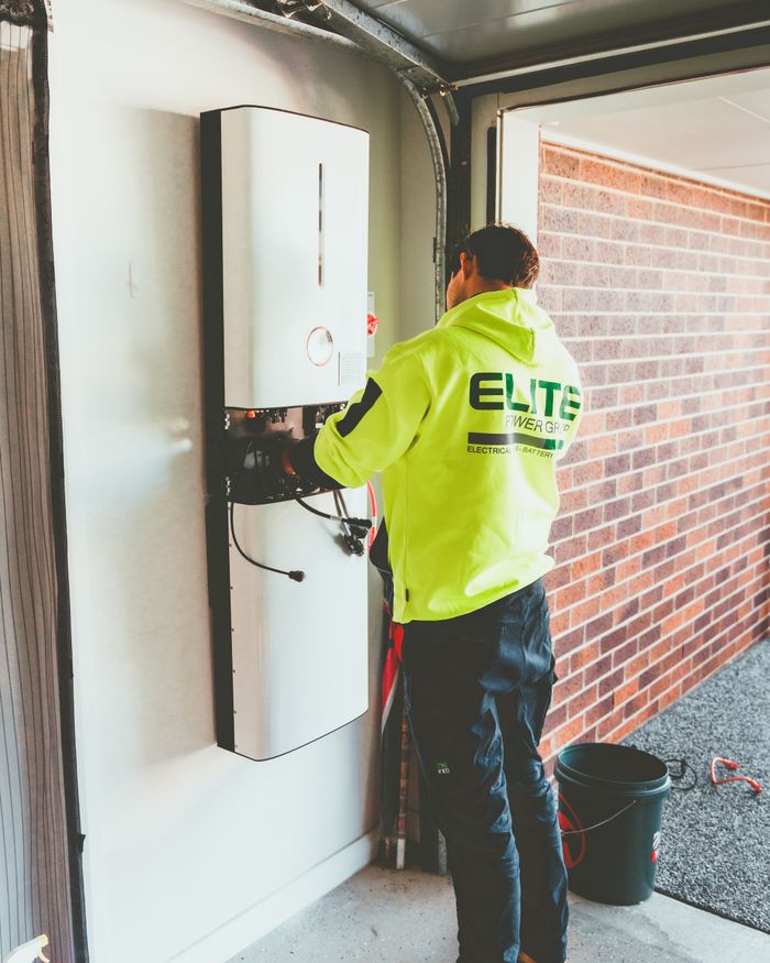 The Art of Drawing Readers In: Your attractive post title goes here Electrician working on a solar inverter installation inside a garage in New South Wales, Australia.